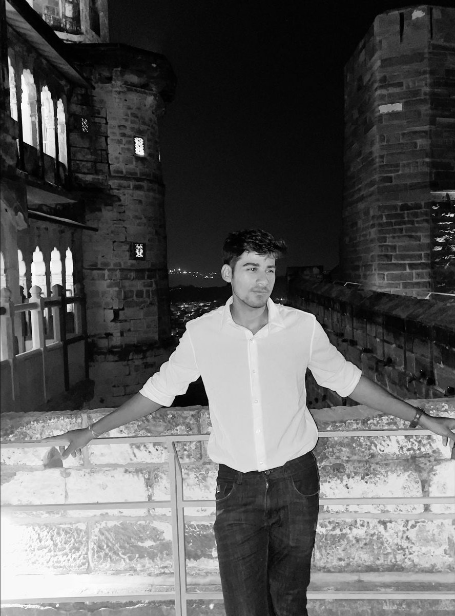 Vaibhav Chajjer standing at a fort in Jodhpur at night